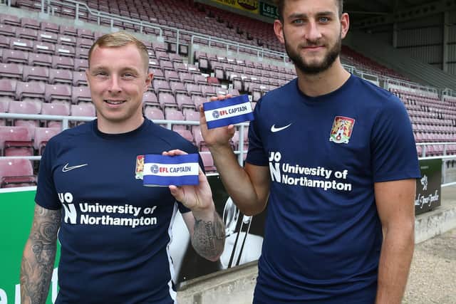 Cobblers club captain Nicky Adams (left) and match day skipper Charlie Goode