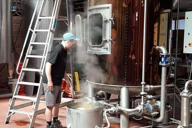 Phipps NBC brewer Ed Garner at work on Monday brewing a batch of Gold Star.