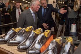 Tricker's managing director Martin Mason shows Prince Charles around the Northampton factory during a visit to mark the 190th anniversary in January 2019