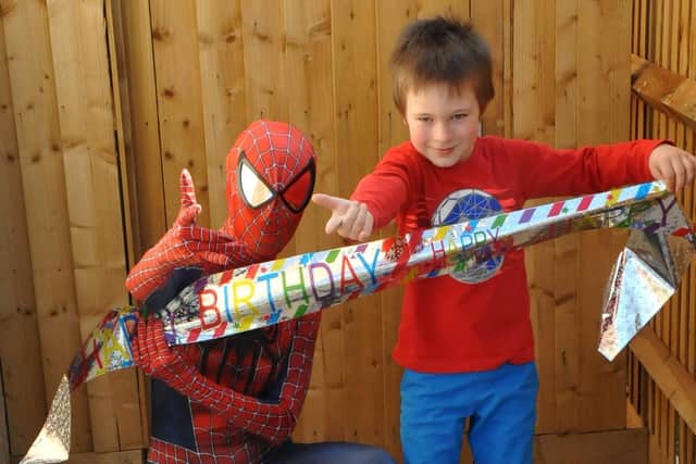 Teddy with his favourite hero, Spiderman. Photo: Darrin Stevens.
