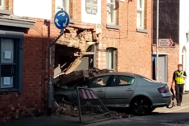 A high-speed car crashed through the wall of Wolfie's Cafe this morning.