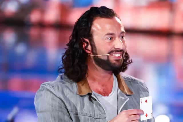 Sean Heydon shows the card Simon Cowell thought of after completing his trick on Britain's Got Talent: Unseen. Photo: Thames Media/ITV