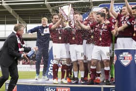 Chris Wilder gets the Champagne spraying started