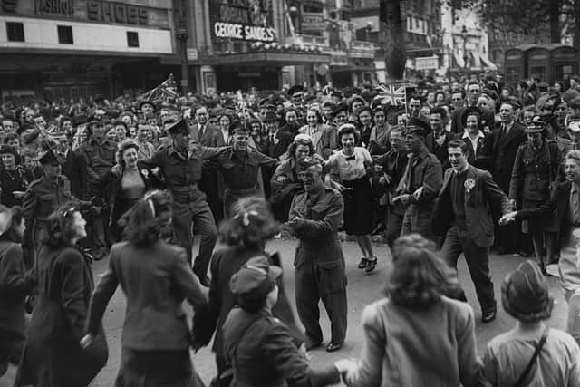 Maybe Maurice can be found somewhere in one of these iconic pictures from May 8, 1945? Photo by Topical Press Agency/Getty Images