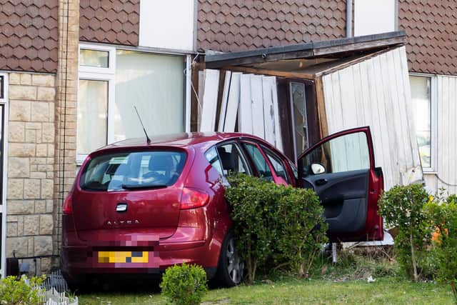 The car pictured after ripping the porch from the house. Picture by Leila Coker.