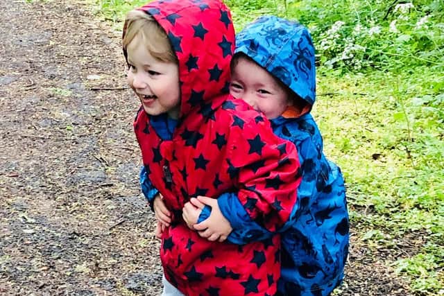 Ethan and Lucas Cooper on one of their daily walks. Photo: Vicki Smith