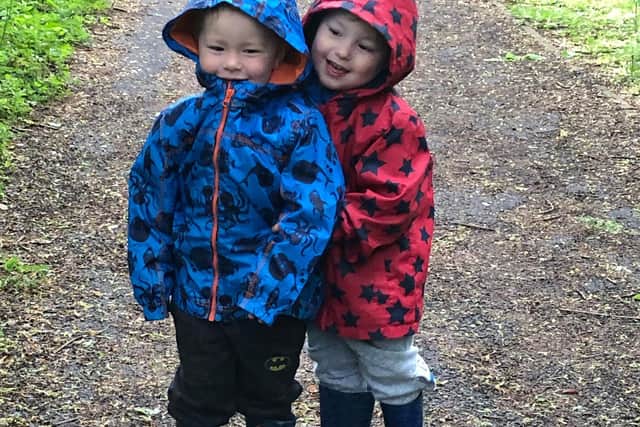 Ethan and Lucas Cooper on one of their daily walks. Photo: Vicki Smith