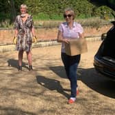 South Northamptonshire MP Andrea Leadsom helps to deliver boxes with Northamptonshire Community Larders founder Miranda Wixon in the background