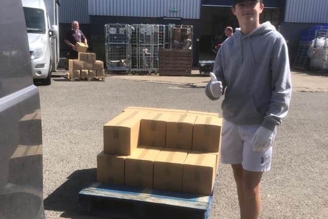 Torin Little collecting boxes destined for the Northamptonshire Community Larders hub in Old Stratford