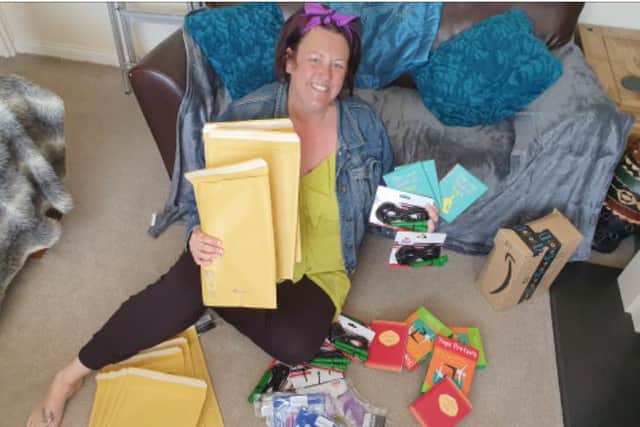 Brookside manager Rebecca Robinson with some of the contents of their activity boxes for adults with learning difficulties in Northampton