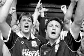 Pat Gavin and player-boss Phil Chard celebrate after the Cobblers' final day win at Shrewsbury in 1993 (Picture: Pete Norton)