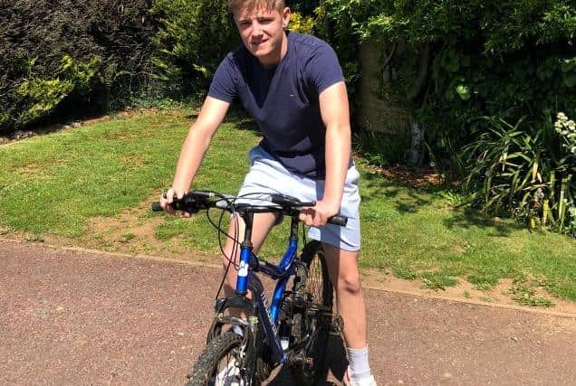 Cameron Dawes on his bicycle ahead of his 50-mile bike ride challenge for charity