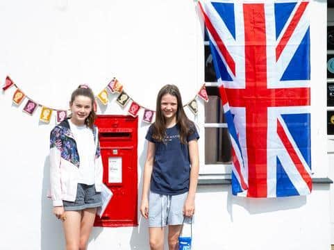 12-year-olds Isabelle (left) and Harriette (right) helped their mum with the doorstep photos.