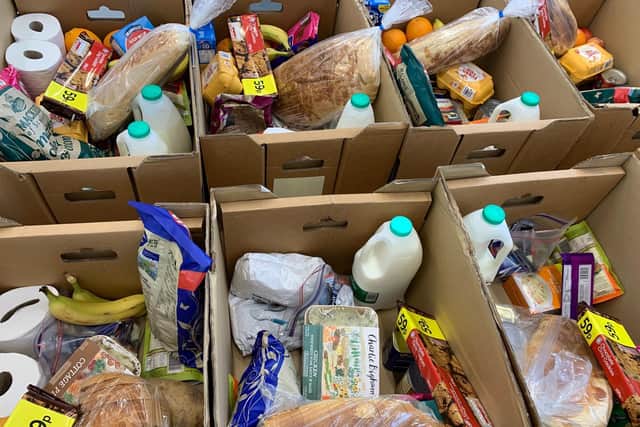 The boxes include bread, milk, eggs and basics that everyone needs.
