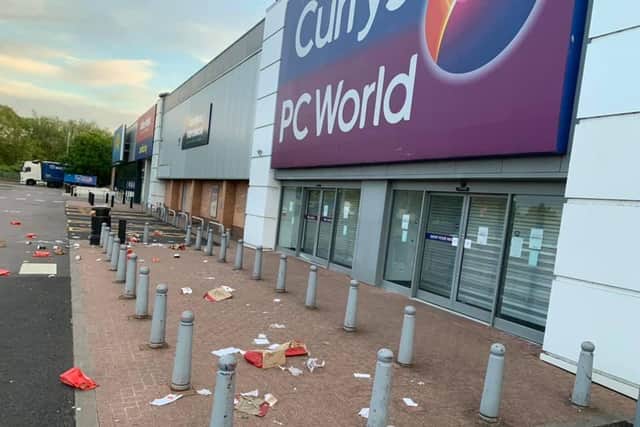 KFC wrappers were strewn across the front of Currys at Sixfields as the bin was so full. Photo: Tony Young