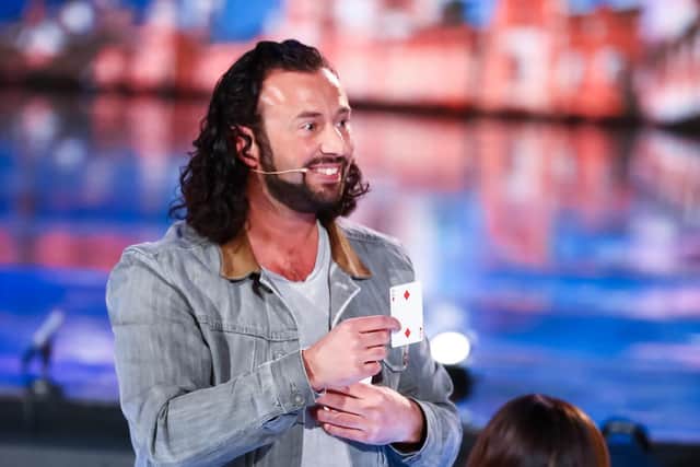 Sean Heydon shows the card Simon Cowell thought of after completing his trick on Britain's Got Talent: Unseen. Photo: Thames Media/ITV