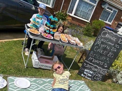 Alfie pictured with his assistants his sister Isla and cousin Ameila who is also staying with her nan.