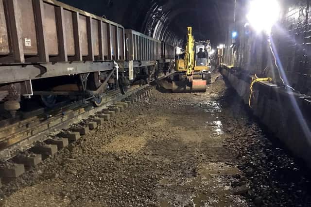 Engineers dug out the track bed to build new drains through the tunnel