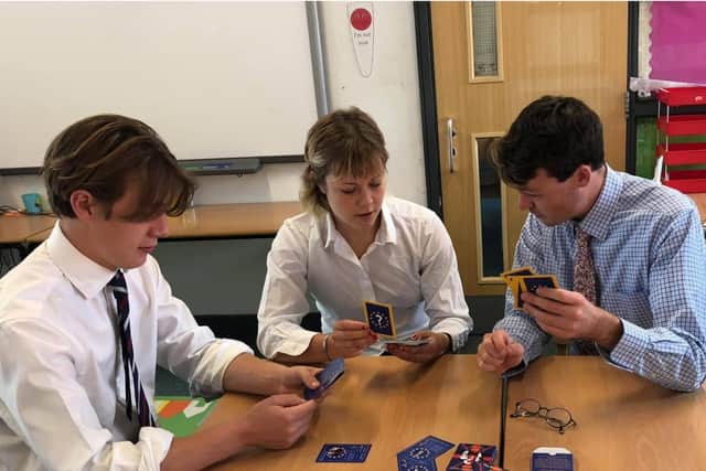 Patch Fordham playing The Brexit Game with two of his students