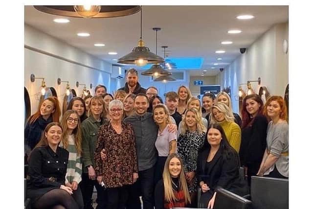 Johnny (centre) has two salons across Northamptonshire and Milton Keynes and is the manager of 33 members of staff. File picture taken before lockdown.