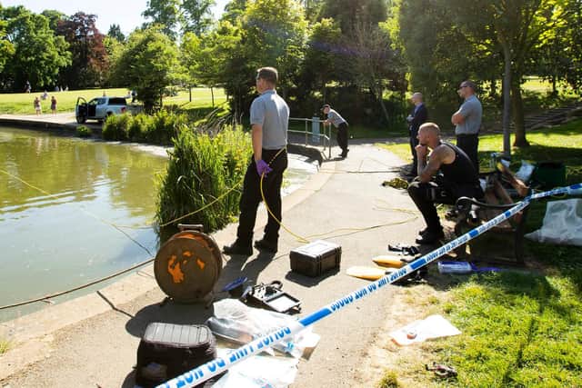 Police divers are conducting a search of a lake in Abington Park. Photo: Leila Coker.