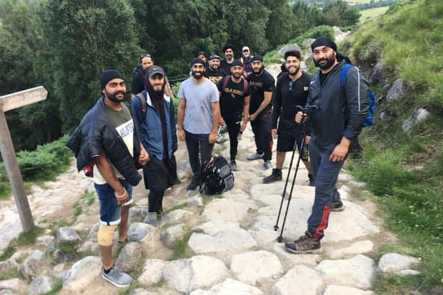 Fundraisers pictured climbing Ben Nevis.