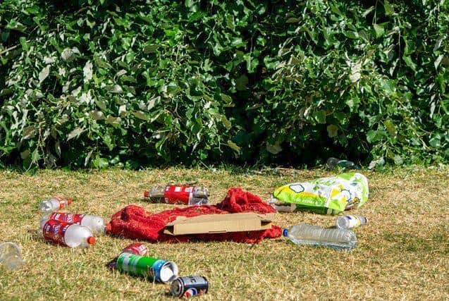 Bottle and pizza boxes were left behind where groups had met up the day before.