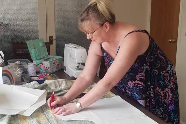 Lyn Firman making scrubs for the NHS from her dining room in East Hunsbury