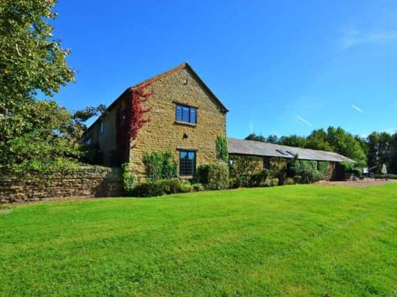 This barn conversion in Overstone is on the market for 1.25 million. Photo: Purple Bricks