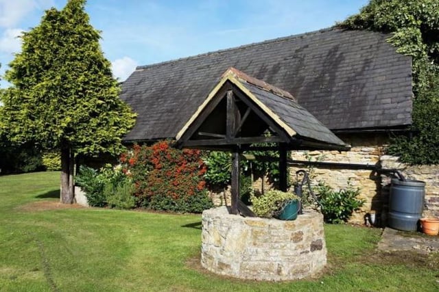 The barn in Overstone has three outbuildings and even a well. Photo: Purple Bricks