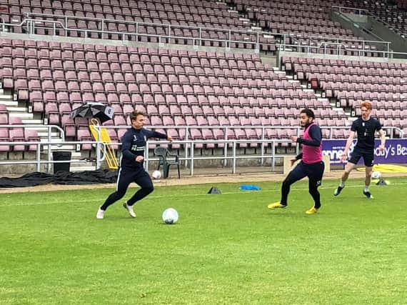 Sam Hoskins, Jay Williams and Callum Morton train with the Cobblers on Thursday morning.