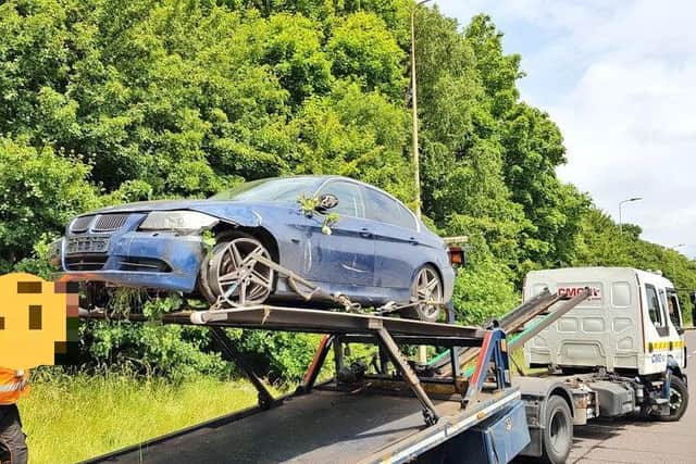 The BMW is recovered after two men fled the scene on the A45 today. Photo: Northamptonshire Police