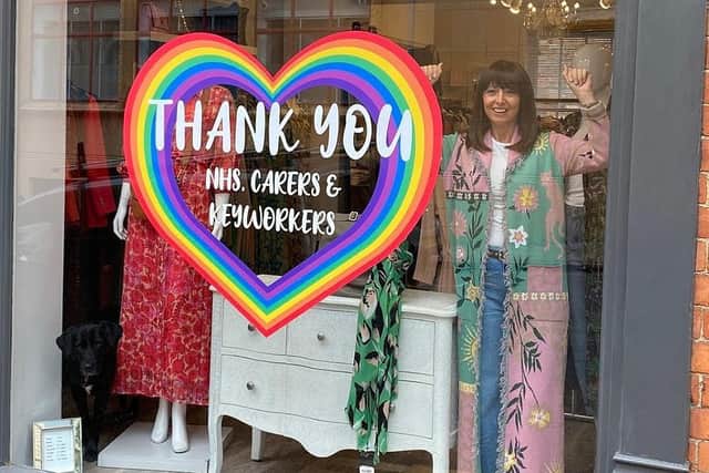 Berties owner Leonie Howe with the 'thank you' heart in the shop window