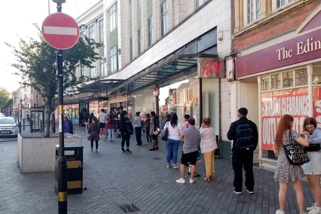 Shoppers queue to get into Sports Direct in Abington Street on the first day non-essential shops can reopen