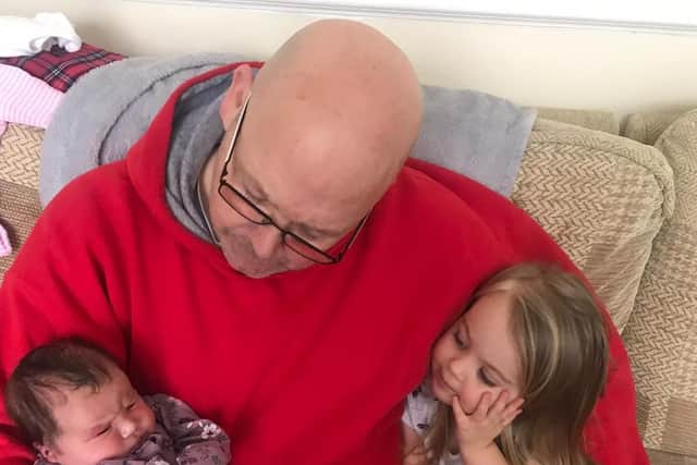 Stephen Lee, pictured with his grandchildren, has beaten Covid-19.