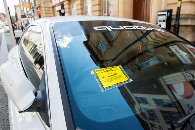 As well as having to pay to park in on-street spaces returning, so did parking wardens handing out tickets for offenders. Photo: Leila Coker
