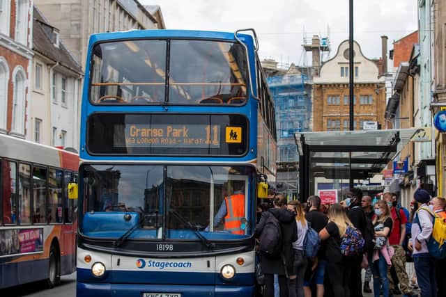 Social distancing is not always adhered to when queuing for a bus. Photo: Leila Coker.