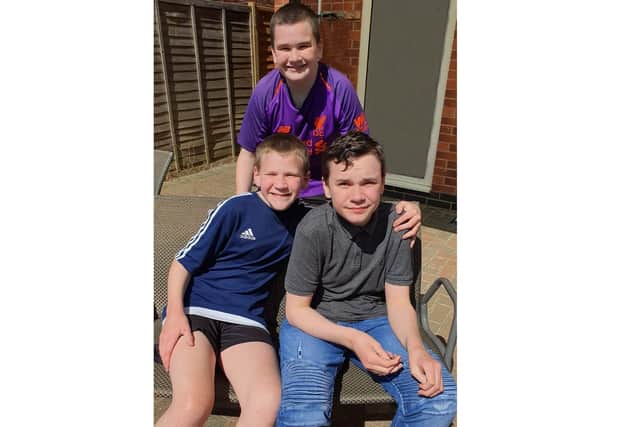 Eoghan (front right) with his brothers Aodhan (back) and Finan (front left). NNL-200618-123536005