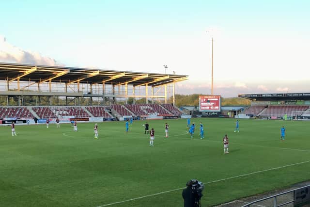 The Cobblers and Cheltenham players get ready for the second half