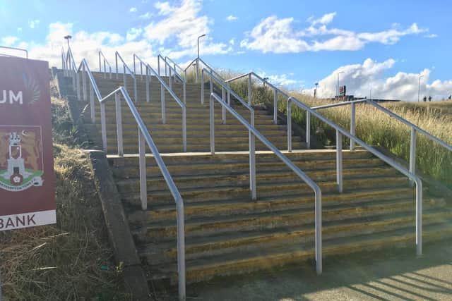 Empty steps heading down to the west stand