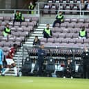 Keith Curle watches on in front of a near-empty West Stand.