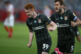 Callum Morton and Charlie Goode can barely believe it as Cobblers stun Cheltenham Town.