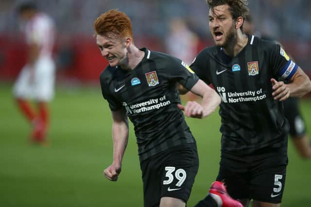 Callum Morton and Charlie Goode can barely believe it as Cobblers stun Cheltenham Town.