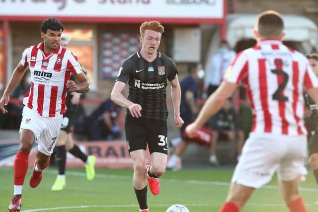 Callum Morton on the attack. The on-loan striker scored twice as the Cobblers won 3-0 to book a place in next Monday's Wembley play-off final