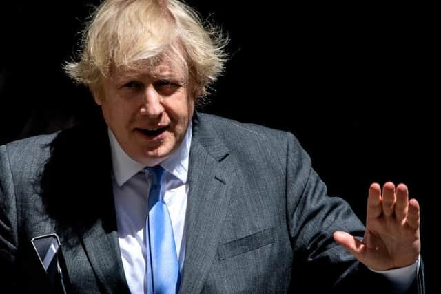 Prime Minister Boris Johnson leaves 10 Downing Street to tell the House of Commons about the coronavirus lockdown easing on June 23. Photo: Getty Images