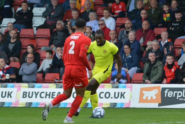 Lee Ndlovu gets on the ball for Brackley in the win at Kidderminster