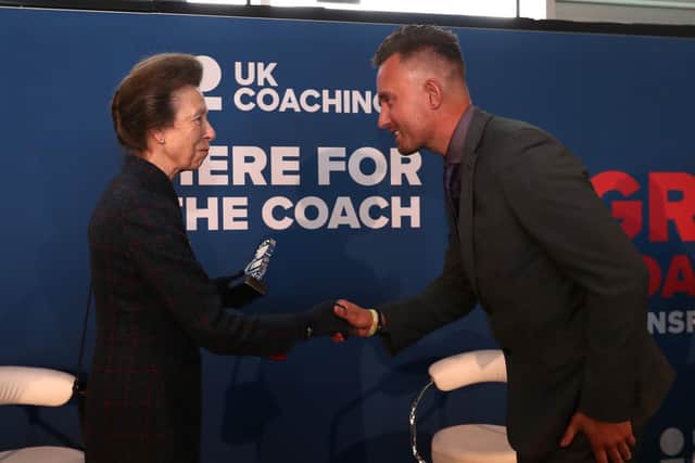 Princess Anne gives Northampton football coach Lee Reade his UK Coaching Hero Award