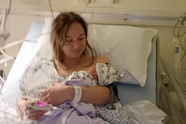 Safe in his mummy's arms - in hospital.