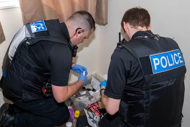 Police seized cash and drugs worth thousands plus weapons during last week's raids