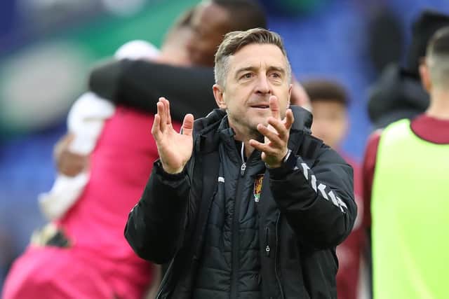 Jon Brady applauds Cobblers' supporters.